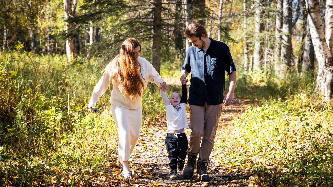 A couple in Fall with their son